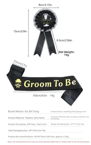 Macro view of Groom To Be black sash and rosette set with detailed size measurements