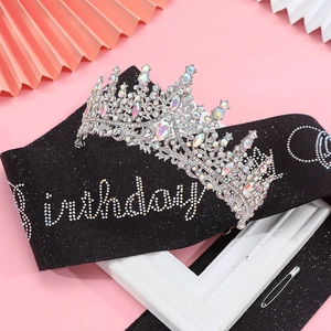 Detail of silver birthday tiara with rhinestones and black glitter sash set