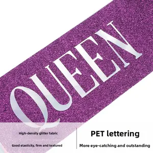 Detail of high-density purple glitter fabric birthday sash with white PET QUEEN letters