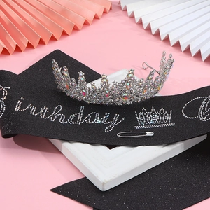 Detail view of sparkling silver rhinestone tiara and black glitter Birthday sash set