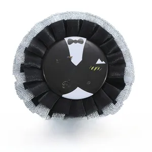 Detail of Groom to Be rosette badge with black ribbon and elegant silver lace trim