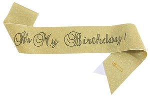 Detail of gold glitter birthday sash with black rhinestone It's My Birthday text and pin