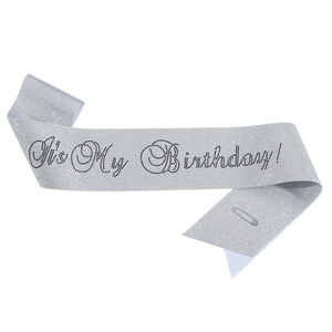 Silver glitter birthday queen sash with black text and safety pin for party decoration