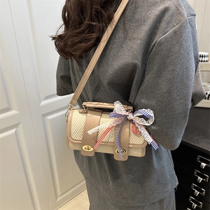 Vintage woven cylindrical crossbody bag with leather trim and plaid lace bow accent