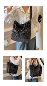 Close-up of vintage black denim tote bag with frayed 'YOUTH' letter patchwork design