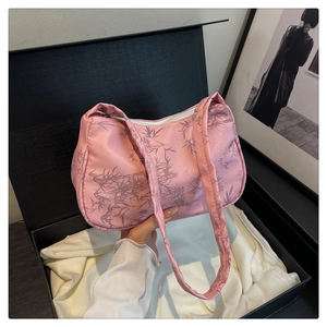Pink nylon shoulder bag with black bamboo leaf print and premium black gift packaging