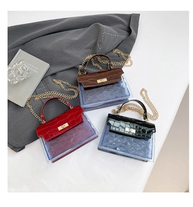 Detailed comparison of red, brown and black PVC handbags with crocodile texture flap
