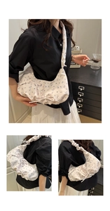Close-up of floral hobo bag featuring drawstring bows and pleated shoulder strap detail