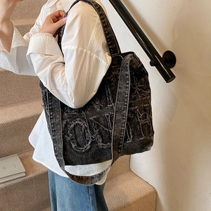 Large black washed denim tote bag with frayed YOUTH lettering for daily casual commuting