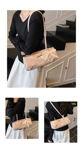 Detail of pink shoulder bag featuring silver bows and white lace bow in balletcore style
