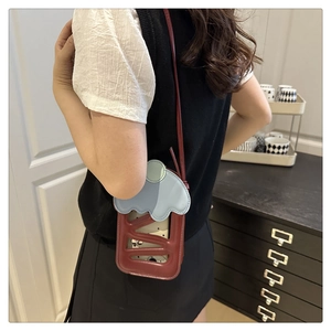 Crossbody phone bag with ice cream design showing hollow pattern on the back of model