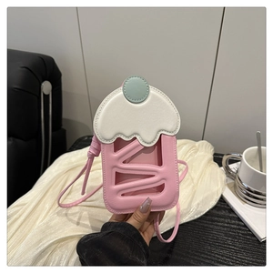 Detailed close-up of a pink cupcake-shaped crossbody bag featuring a clear phone window