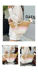 Close-up of color-block straw tote bag with cotton rope handles and lace bow detail