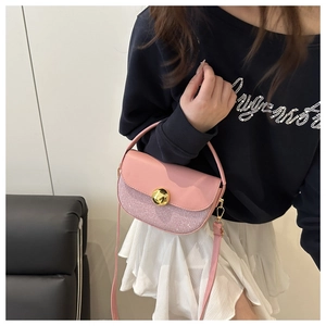 Detail of pink half-moon crossbody bag with sequin patchwork and gold metal rotary lock