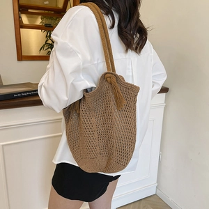 Brown woven cotton tassel shoulder bag for women with spacious casual vacation style