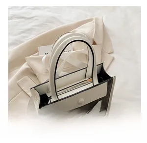 Top view of large tote bag with brown monogram pattern and beige leather stitching