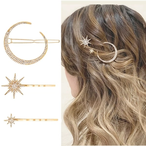 Three-piece golden crescent moon and star hair clips set with sparkling crystals
