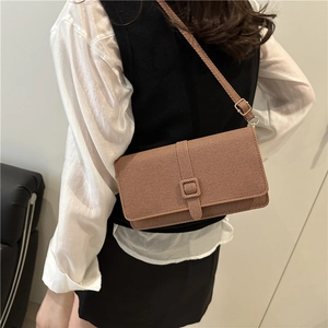 Classic tan textured shoulder bag with square buckle and adjustable strap for women