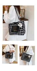 Detail of checkered tweed tote bag with black leather pocket and tiger charm