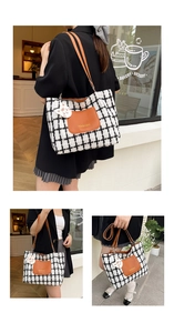 Detail of checkered tote bag with brown leather pocket and white cat keychain charm