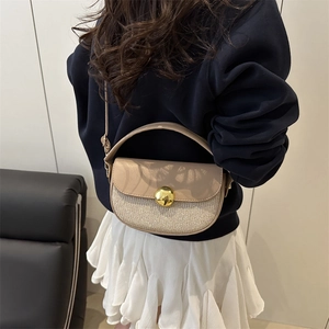 Chic beige crossbody saddle bag with glitter patchwork and gold spherical buckle details