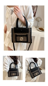 Detail of a brown tote bag with gold M logo, monogram print, and black leather trim