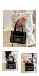 Detail of monogram tote bag with gold M logo, leather handles and woven shoulder strap