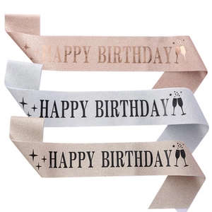 Detailed glitter birthday sashes in rose gold, silver, and champagne with black lettering