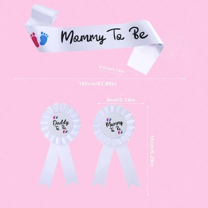 Detail showing Mommy to Be white satin sash and badges with footprints for baby shower