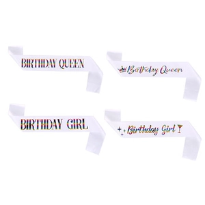 Detail of white satin birthday sashes with rainbow gradient Birthday Queen text