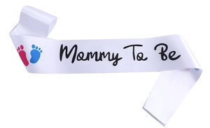 Detailed view of Mommy To Be white satin sash with gold foil font and footprint icons