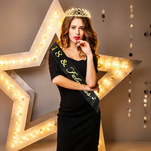 Detail of 18th birthday gold rhinestone tiara and 18 & Fabulous black satin sash set