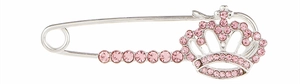 Close-up of silver crown brooch with pink rhinestones for birthday party gift