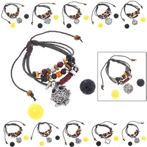 Detail of bohemian multilayer bracelet with leather cords, wooden beads, and owl charm