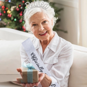 Retired tiara and Officially sash set worn by a woman at a retirement party celebration