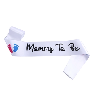 White satin Mommy To Be sash with pink and blue footprints for baby shower parties