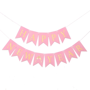 Pink Happy New Year banner with gold foil letters and champagne glass icons for party decor