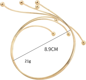 Detail of multilayer golden spiral cuff bracelet with 8.9cm diameter and 21g weight