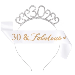 Close-up of silver rhinestone 30th birthday crown and white 30 & Fabulous satin sash set