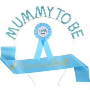 Detail of light blue Mom to Be sash, rhinestone headband and Daddy to Be badge set