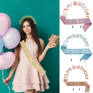 Close-up of birthday party set with glitter sash and metal headband for women's birthday decor