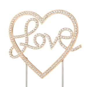 Detailed view of the gold LOVE heart cake topper with sparkling crystals for wedding decor