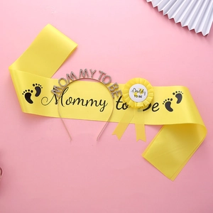 Mommy To Be yellow satin sash with rhinestone headband and Daddy To Be badge set