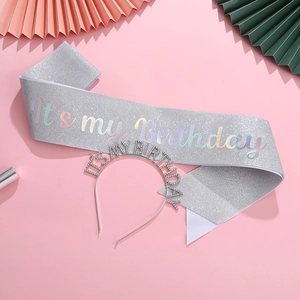 Close-up of sparkling It's my Birthday rhinestone headband and silver sequin sash set