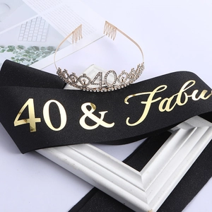 Detailed view of rhinestone 40th birthday tiara and 40 & Fabulous black satin sash set