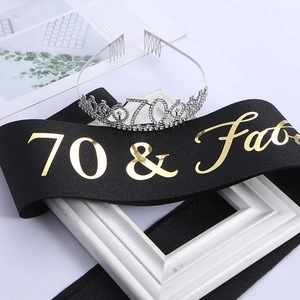 Detail of 70th birthday set with silver rhinestone crown and 70 & Fab black satin sash