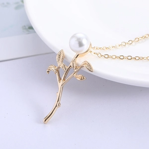 Elegant gold leaf branch necklace with a large round white pearl pendant for women