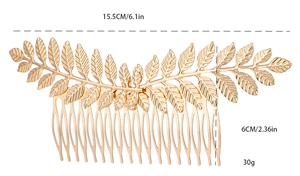 Macro shot of gold leaf bridal hair comb showing 15.5cm length and 6cm width dimensions