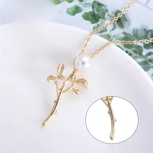 Detail showing natural white pearl and gold leaf pendant with high-polish electroplating
