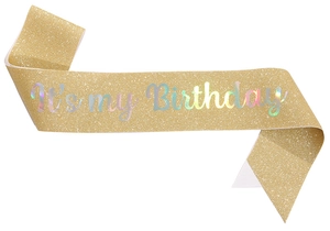Detail of glitter gold birthday sash with holographic It's my Birthday lettering